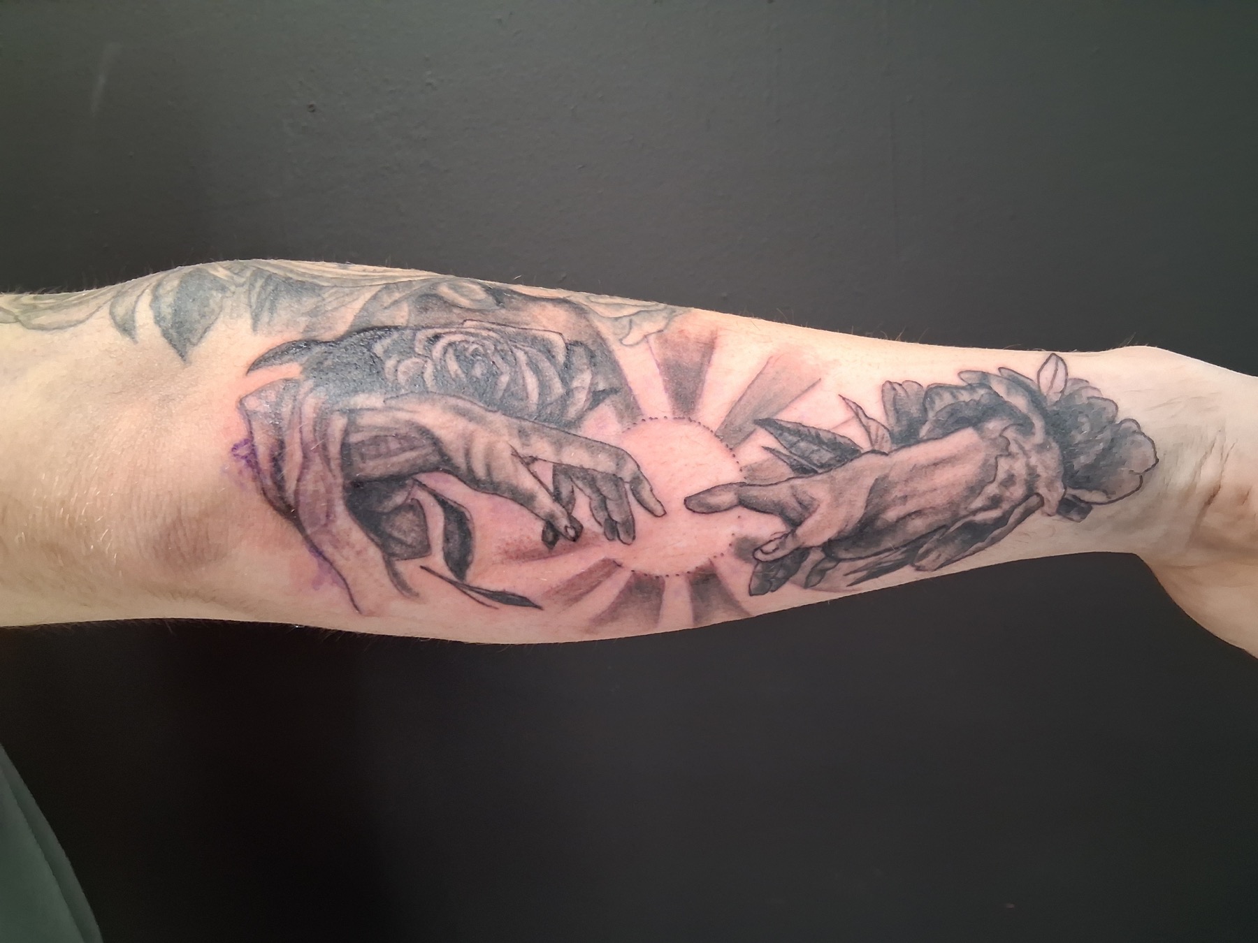 Black and gray hands tattoo by Tony Parisi